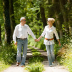couple-walking-through-forest