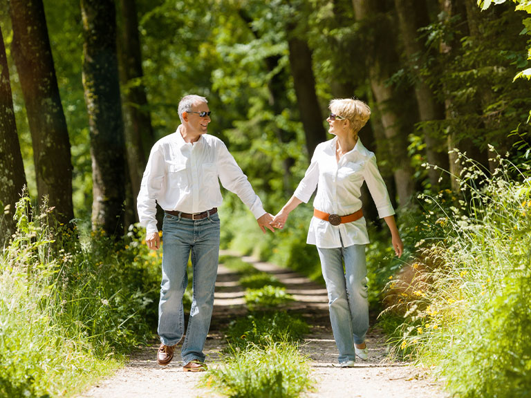 couple-walking-through-forest