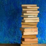 pigeon-forge-stack-books-blue-background