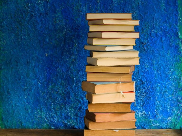 pigeon-forge-stack-books-blue-background