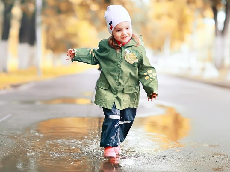 pigeon-forge-child-splashing-puddle-autumn