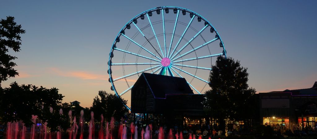 The Great Smoky Mountain Ferris Wheel lights up the evening sky at The Island in Pigeon Forge.
